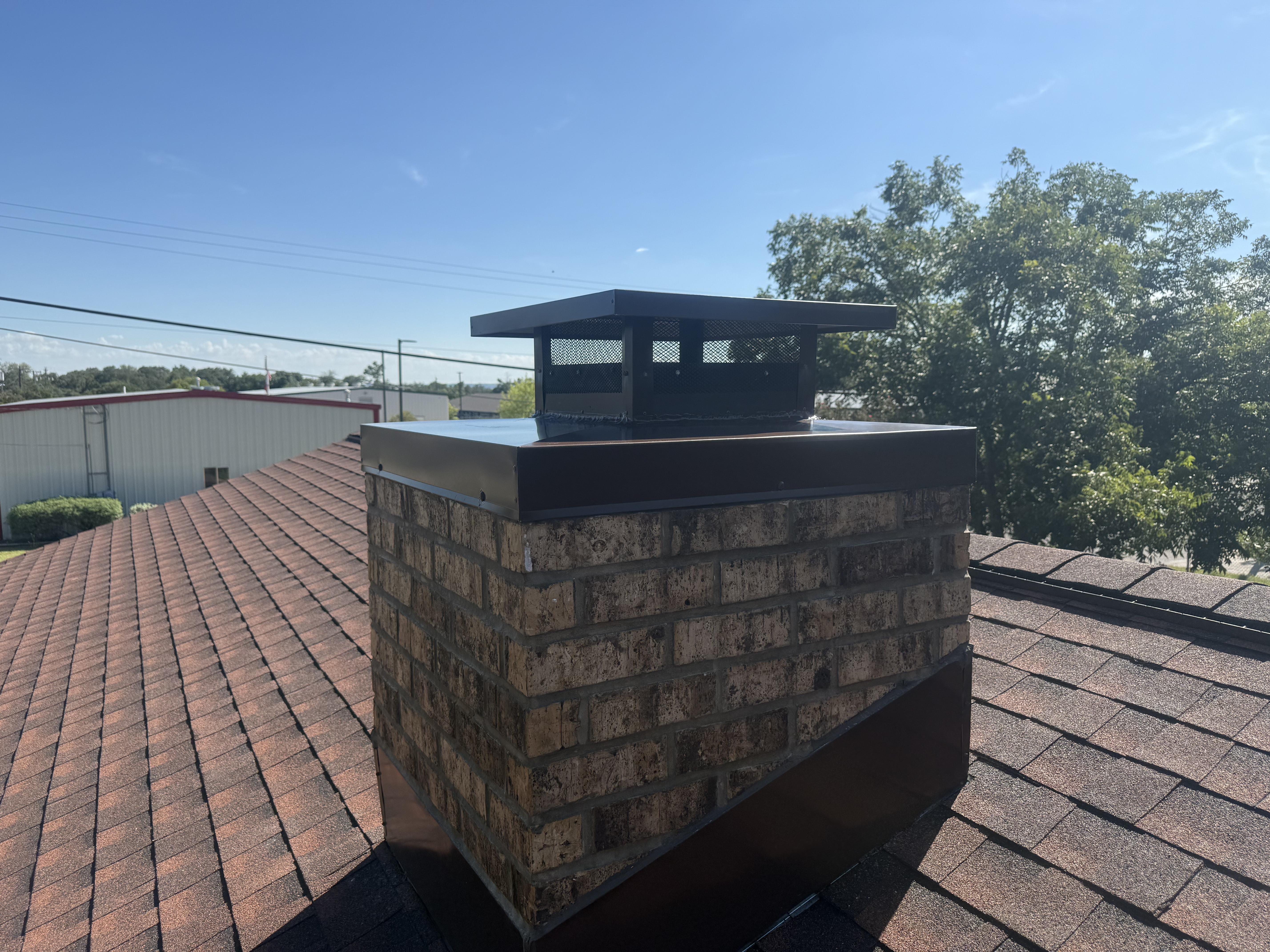 Black custom cap on tan brick
